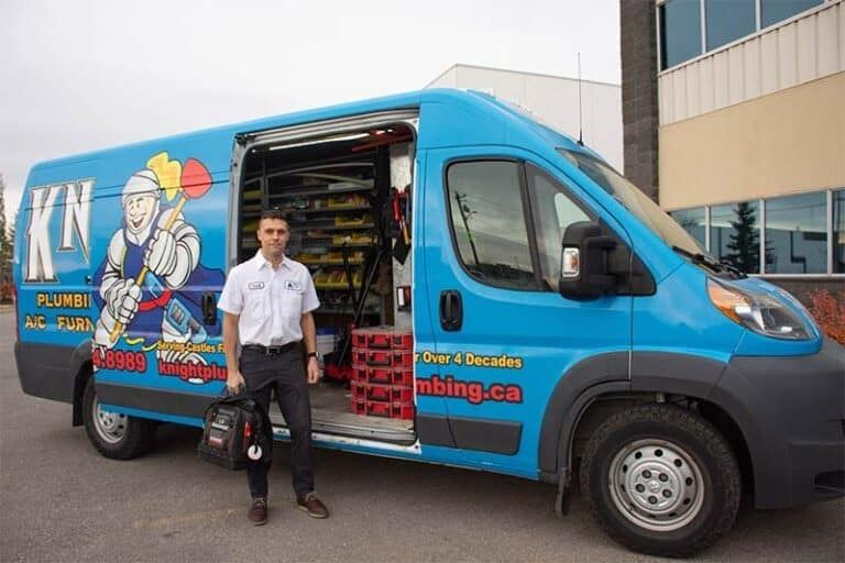 Plumber with his service vehicle